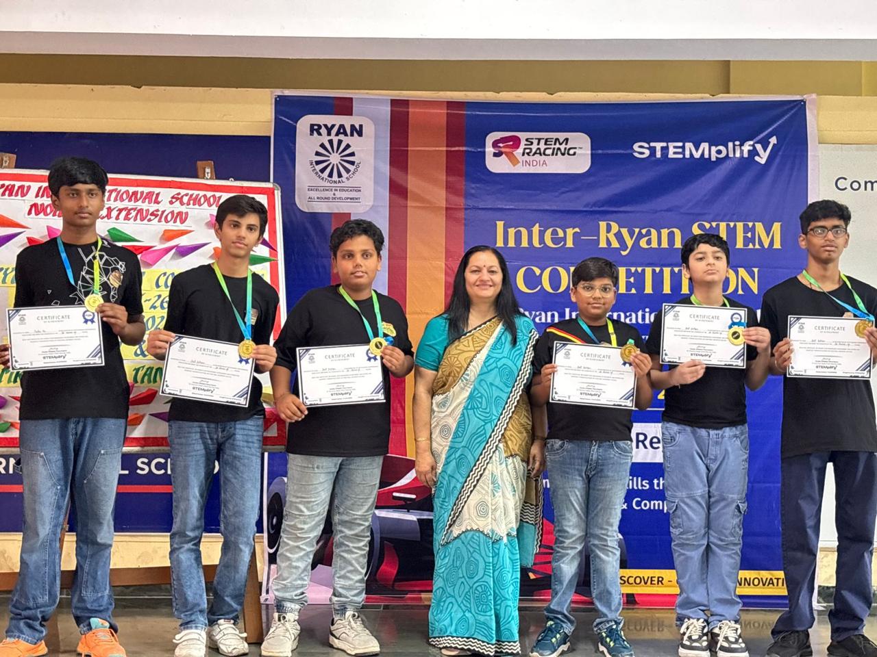 Devil Drifters team at Inter-Ryan STEM Competition with certificates and medals